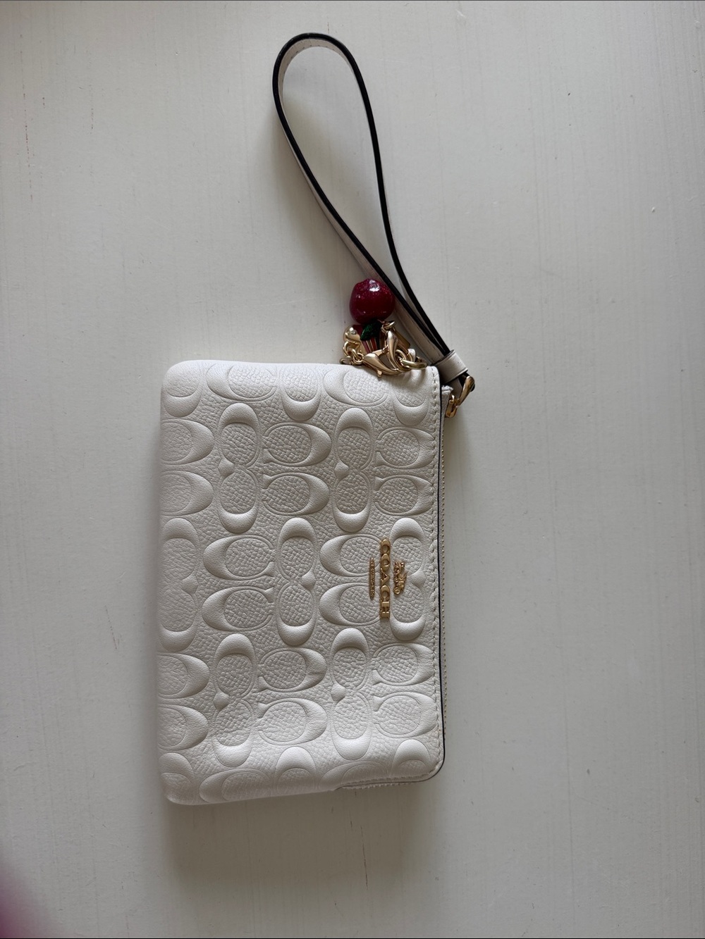 Coach White Embossed Signature Leather Wristlet with Cherry Charm